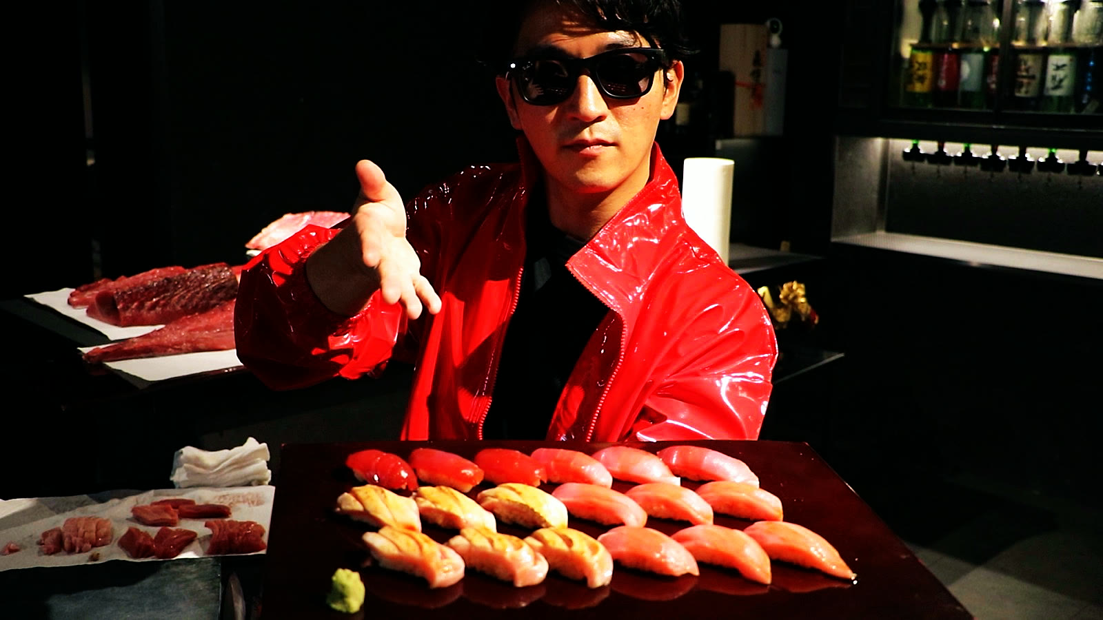 A tray of bluefin tuna nigiri presented by the host