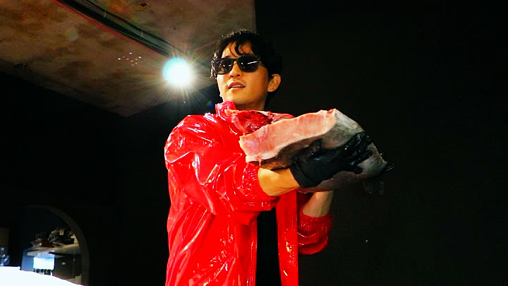 A block of tuna shown to the room