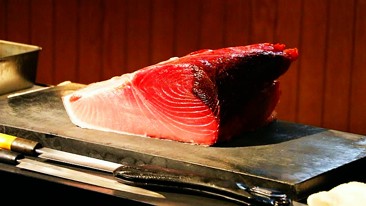 A block of bluefin tuna on the cutting board