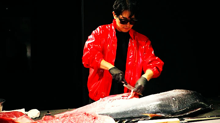 Trimming a side of tuna