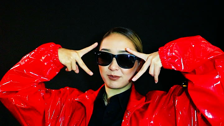 A member of the team in the red show jacket