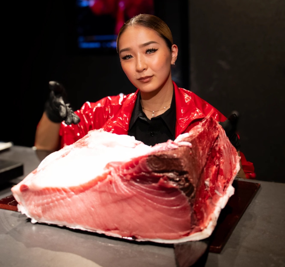 A large block of bluefin tuna belly presented at the counter